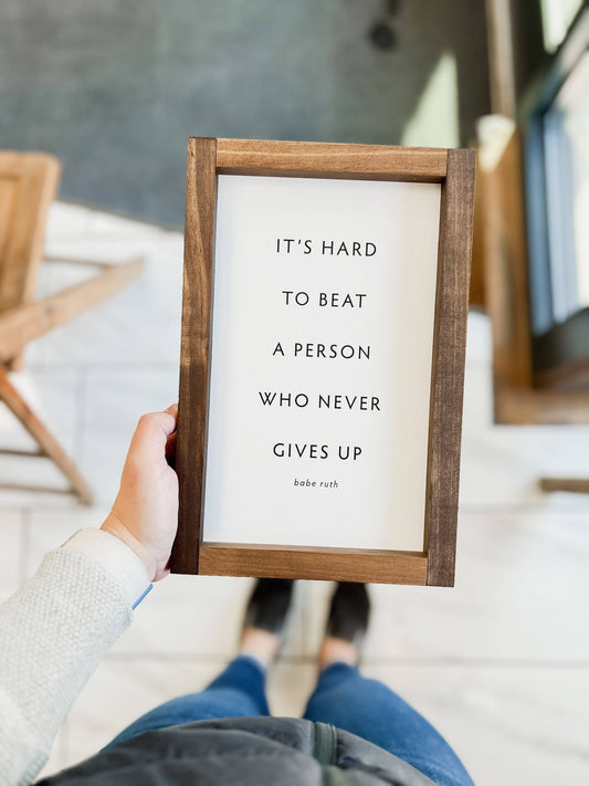 It's Hard to Beat a Person... | Sign